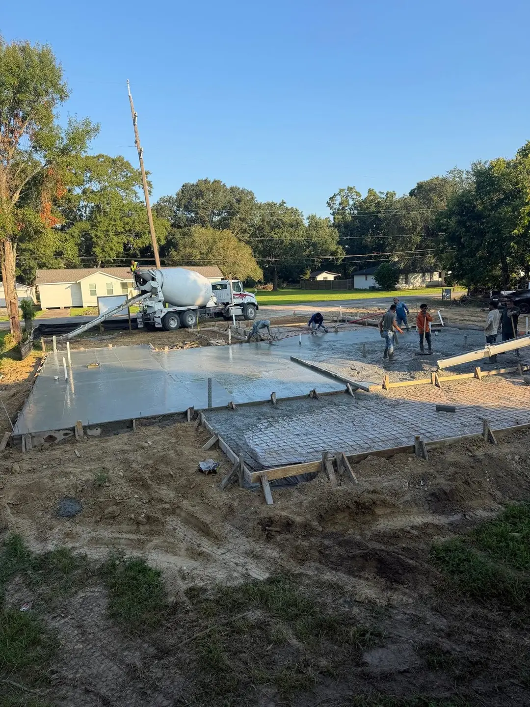 Concrete truck pouring a house slab