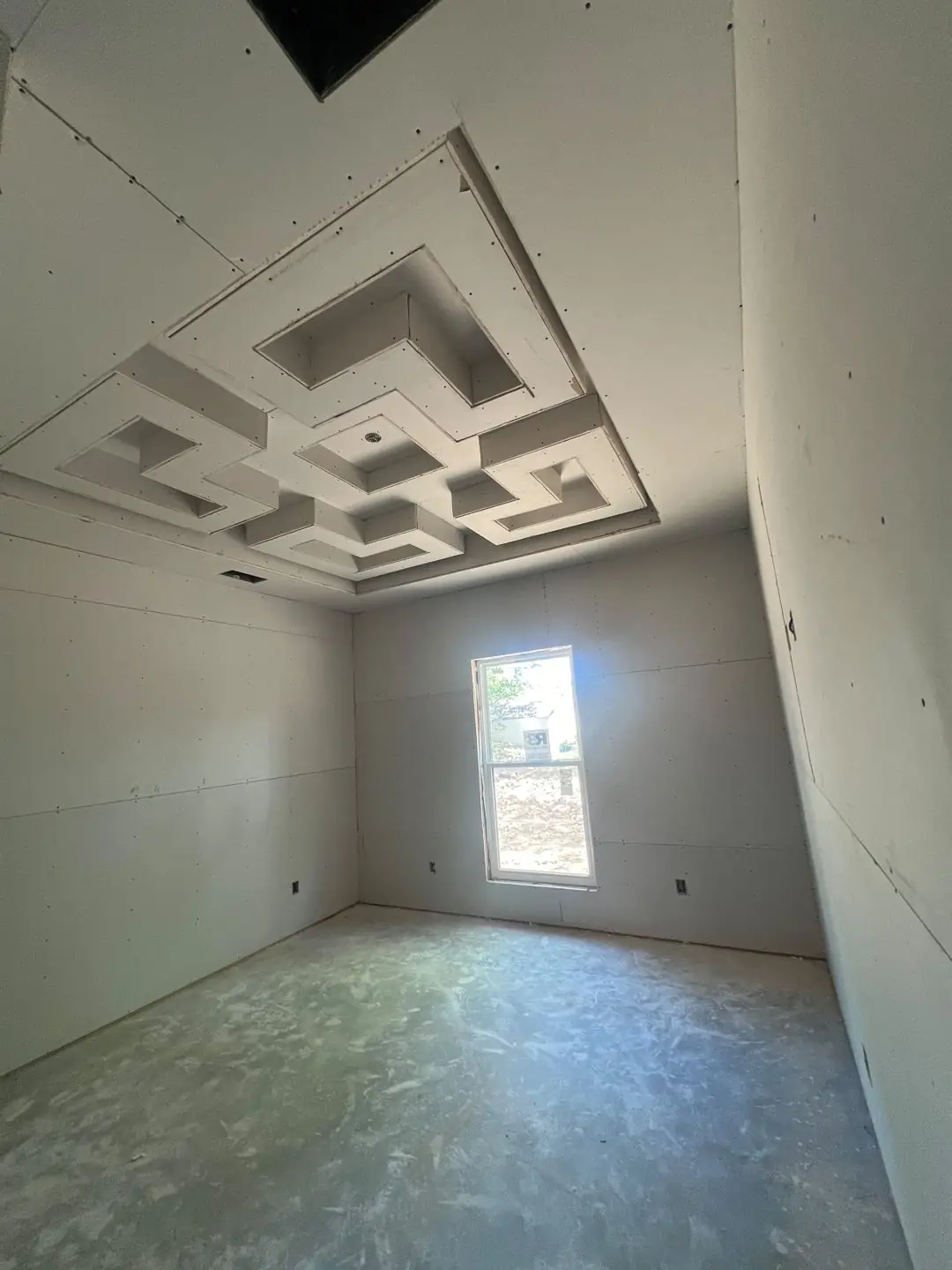Drywall stage, tray/coffer ceilings, exposed beams, vaulted