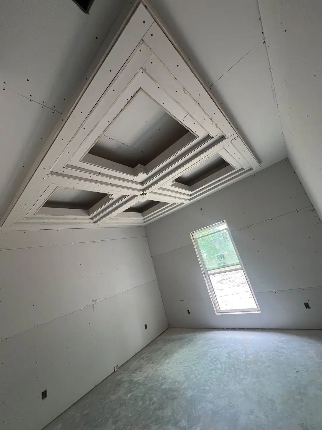 Drywall stage, tray/coffer ceilings, exposed beams, vaulted