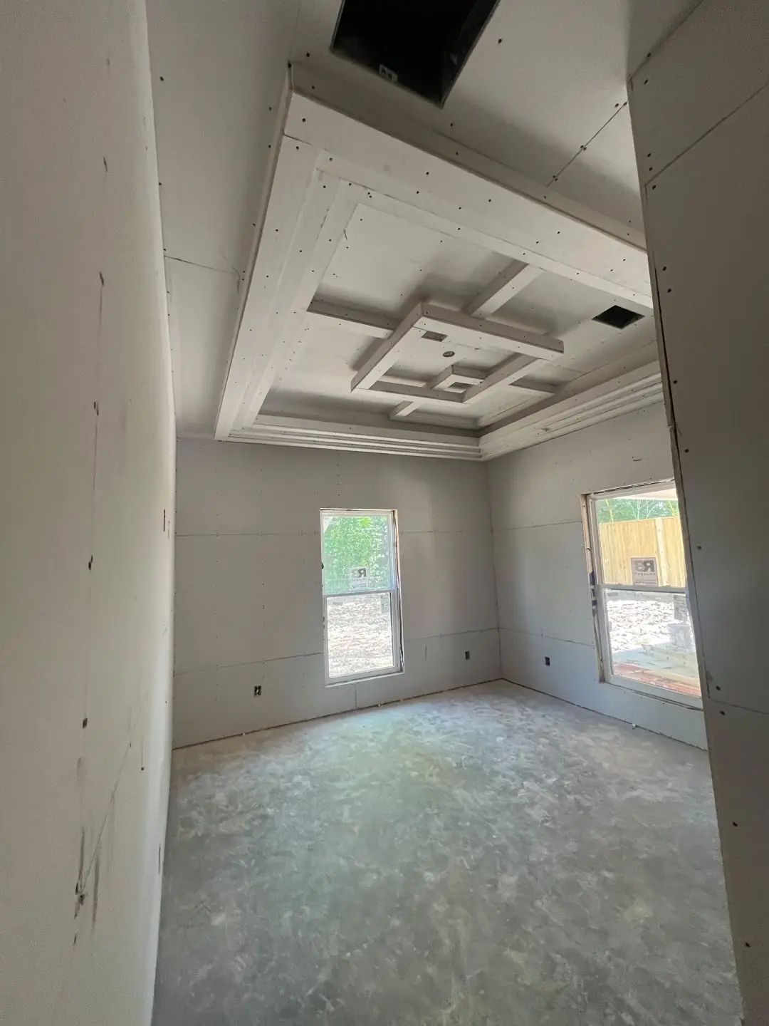 Drywall stage, tray/coffer ceilings, exposed beams, vaulted