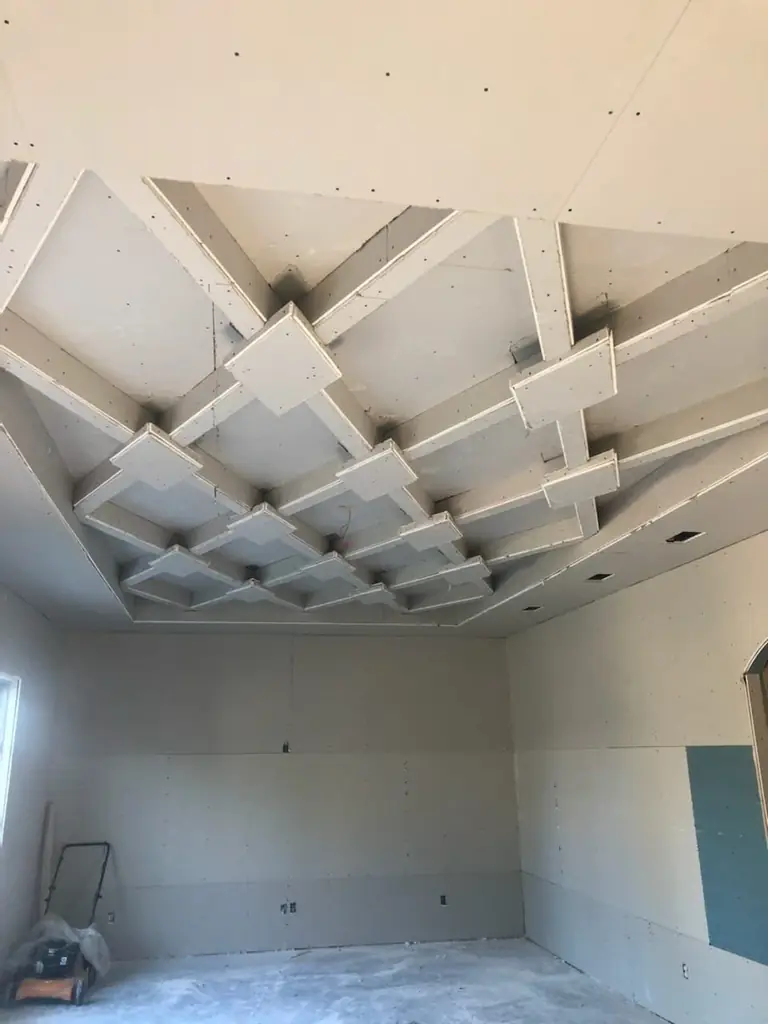 Drywall hung, finished tray ceiling, empty room