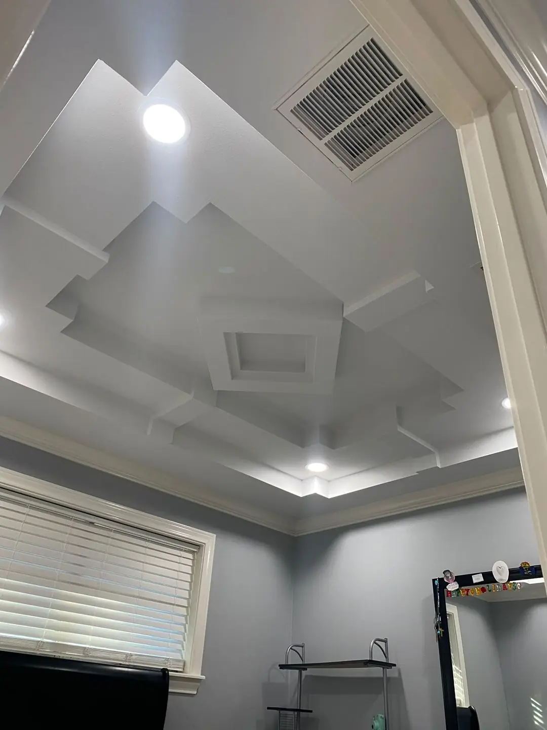 Step tray ceiling finished with recessed lights