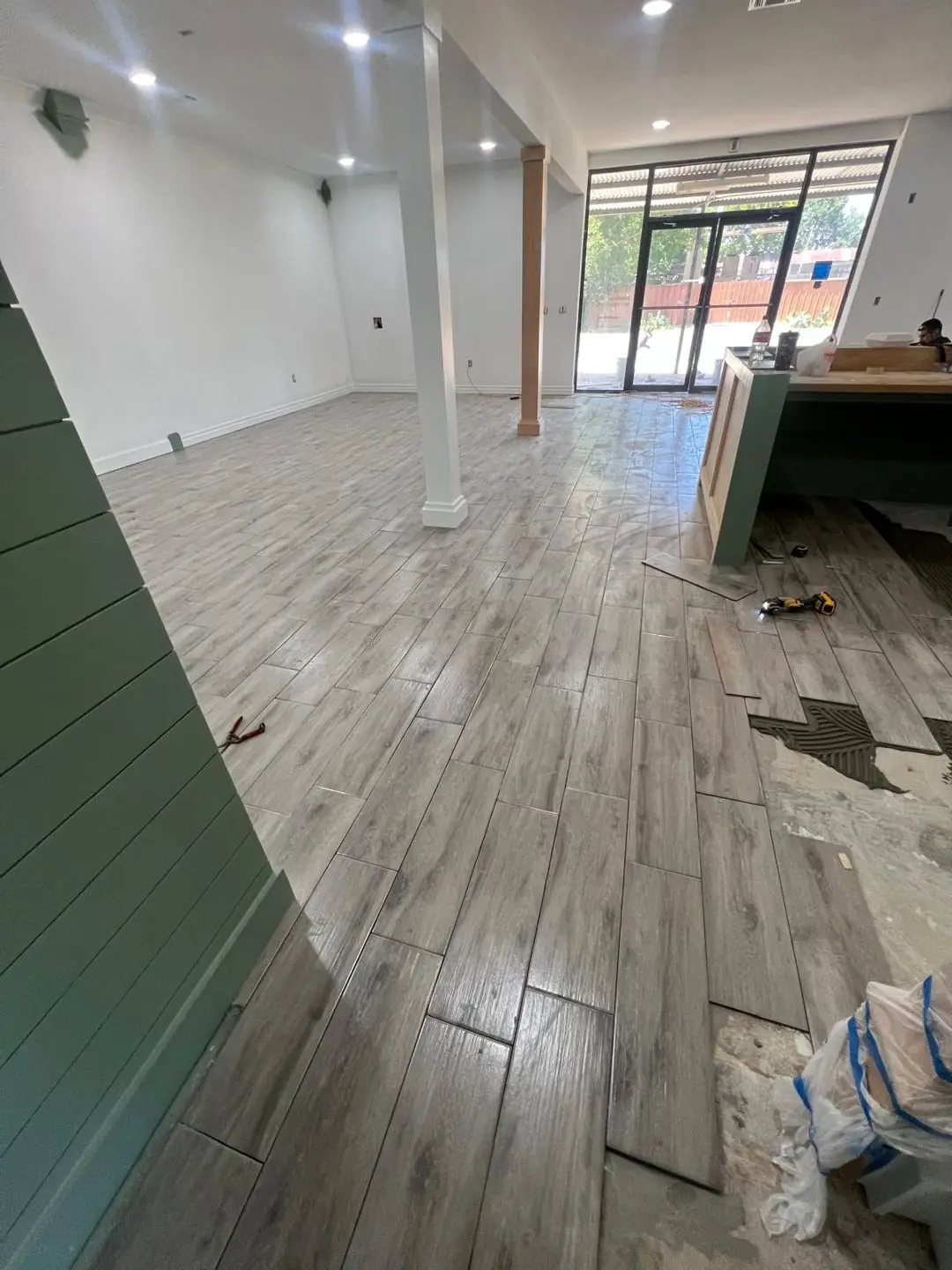 Wood-look tile going down in a commercial space, Beaumont, TX