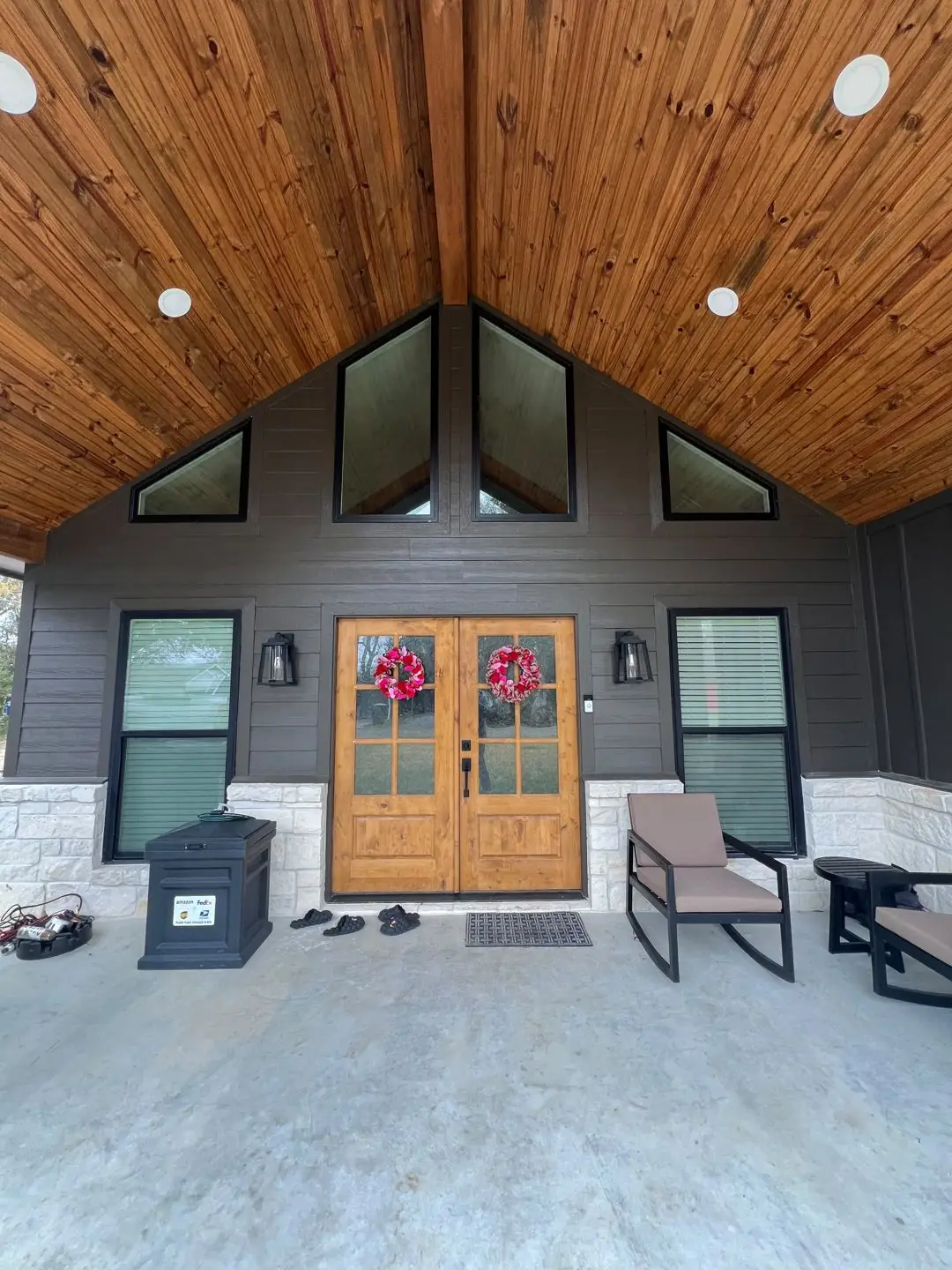 Finished entry: double stained wood doors, gable, porch, tile floor inside