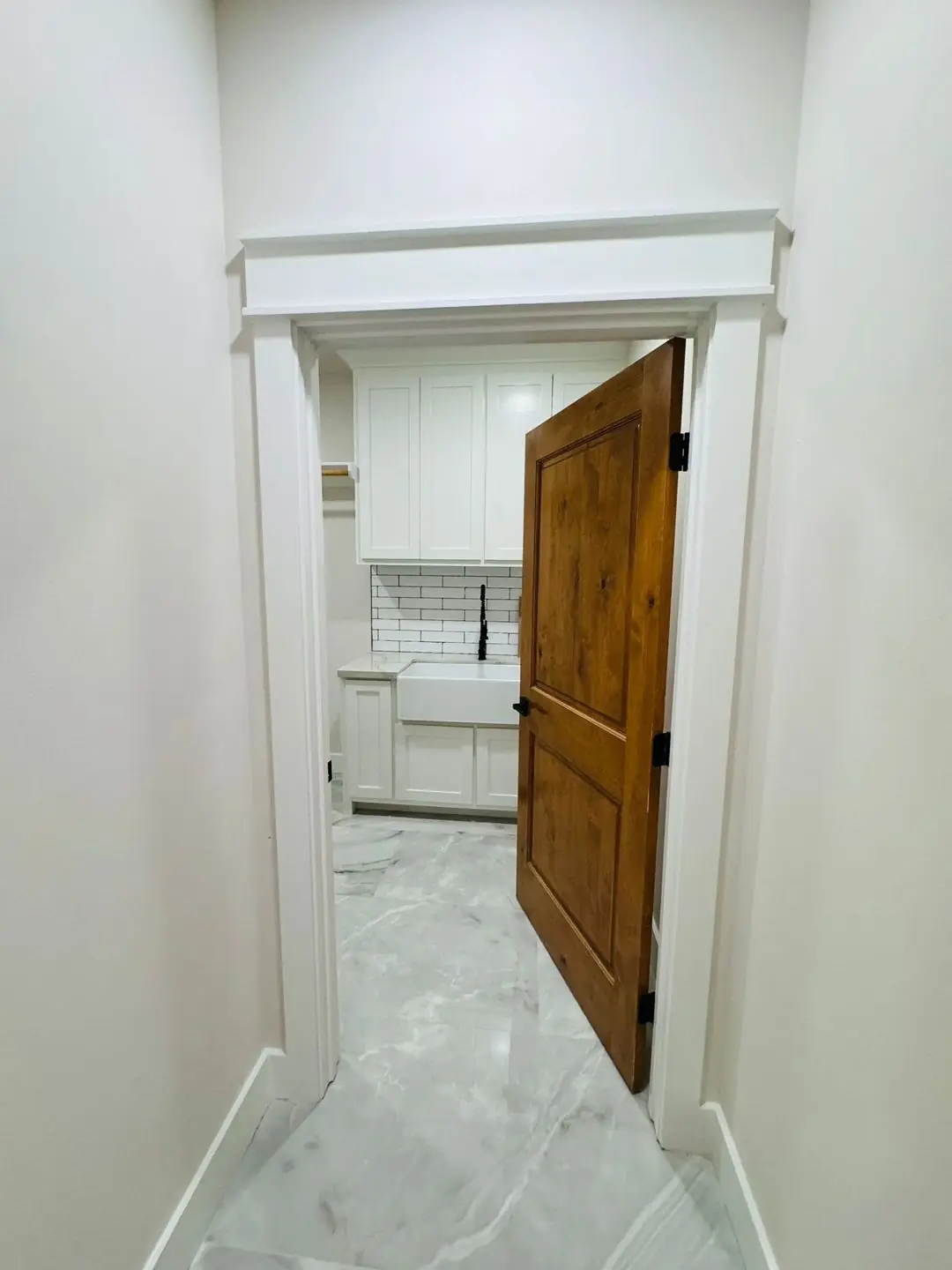 Finished interiors: pantry door, hallway, room