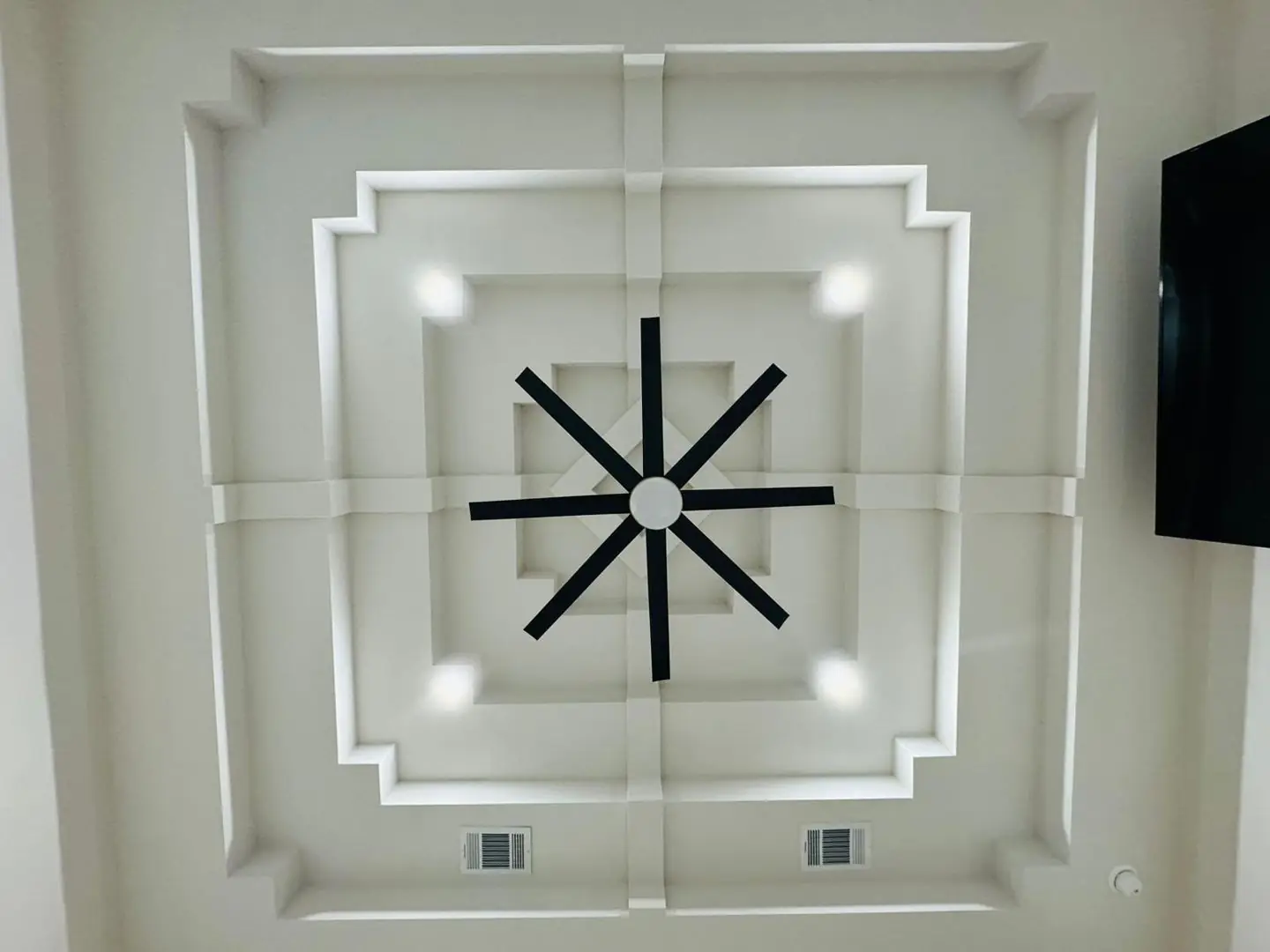 Finished living/kitchen: vaulted beams, fan medallions, marble tile