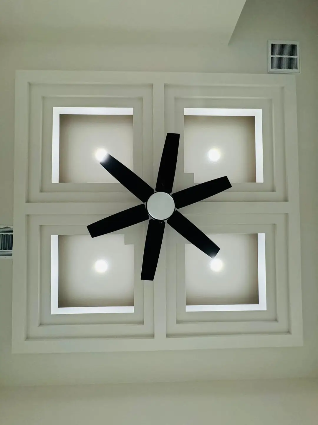 Finished living/kitchen: vaulted beams, fan medallions, marble tile