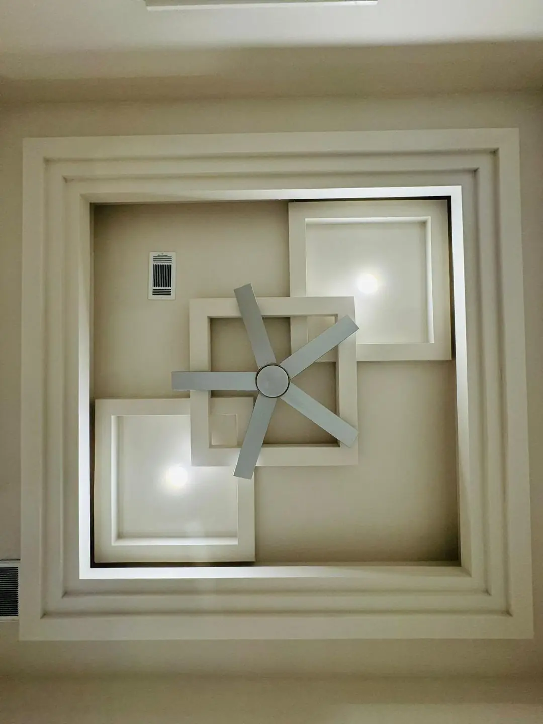 Finished living/kitchen: vaulted beams, fan medallions, marble tile