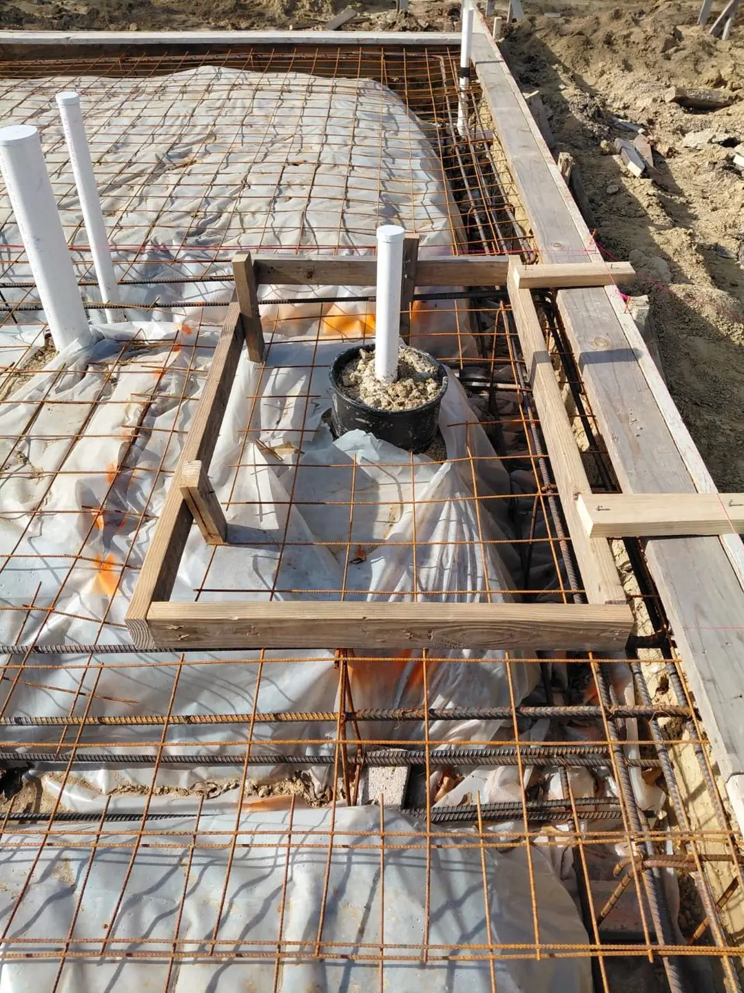 Slab rebar/plumbing close-up before pour