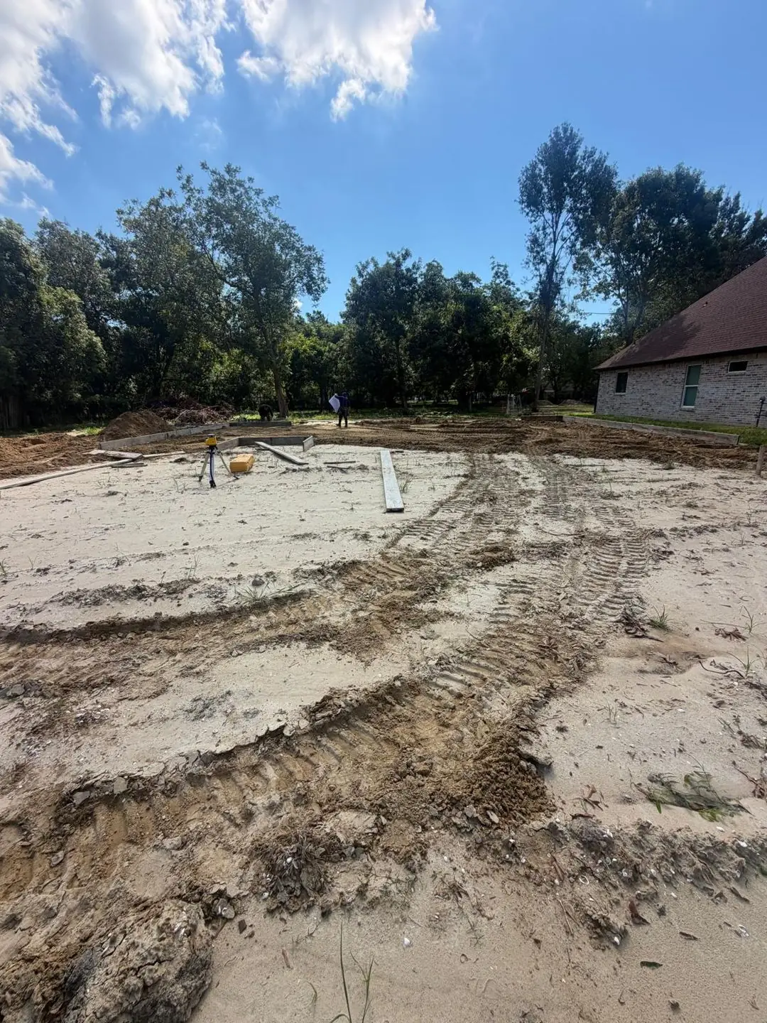 Lot/slab prep, wide, house next door in shot, Groves, TX