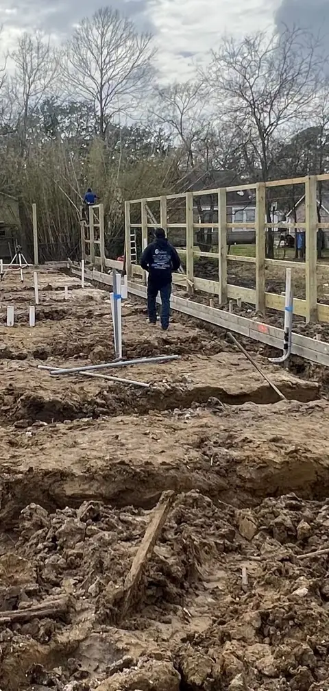 Slab prep: forms, pipe stub-outs, treated posts/fence