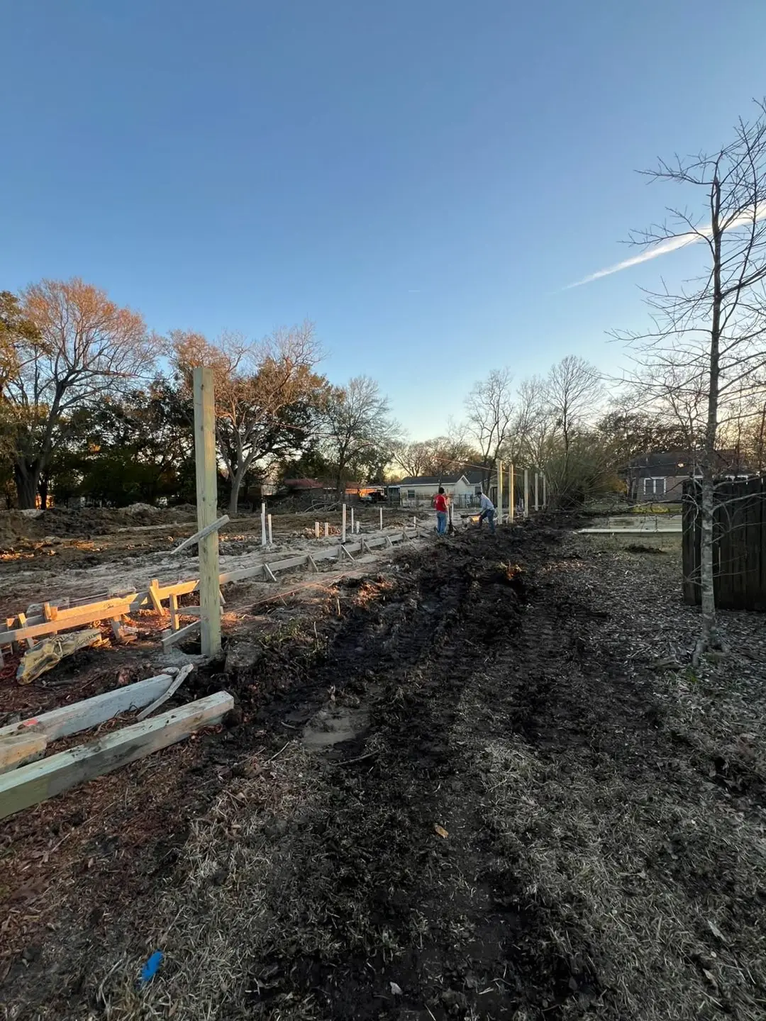Slab prep: forms, pipe stub-outs, treated posts/fence