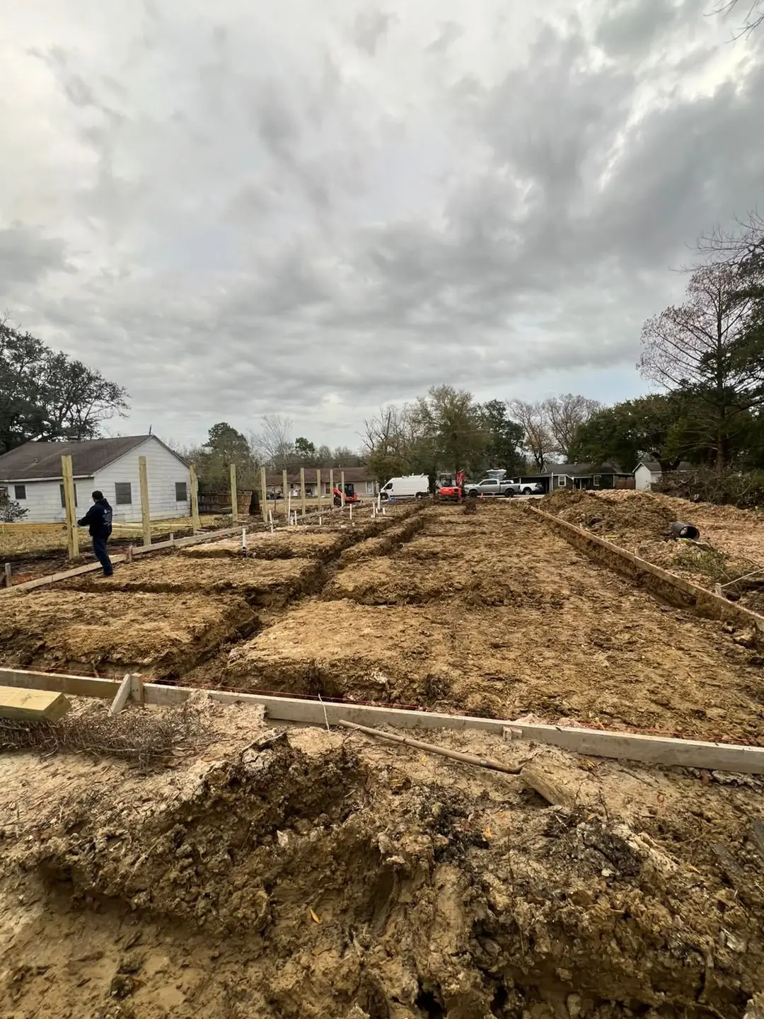 Slab prep: forms, pipe stub-outs, treated posts/fence