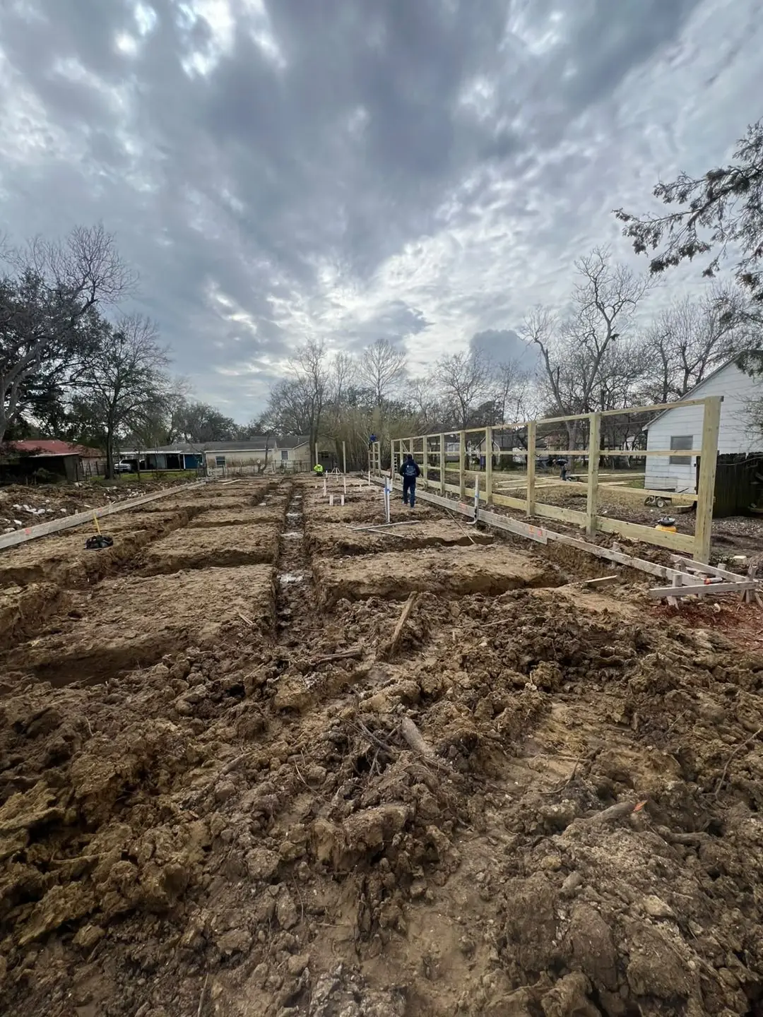 Slab prep: forms, pipe stub-outs, treated posts/fence