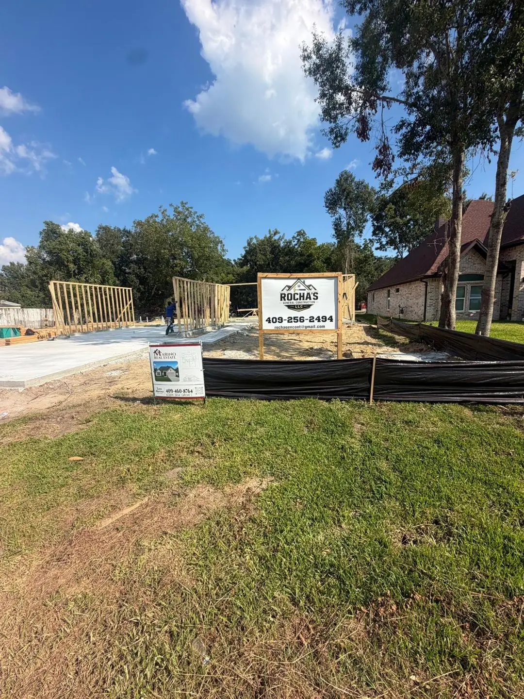 Framing with Rocha's sign and plan board