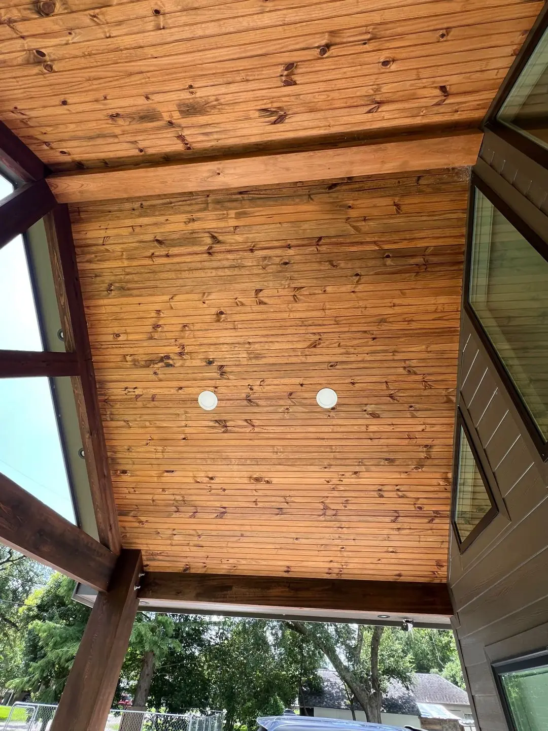 Framing / spray foam / insulation / drywall stages: tray ceilings, scaffold, workers, plumbing PEX manifold, electrical conduit