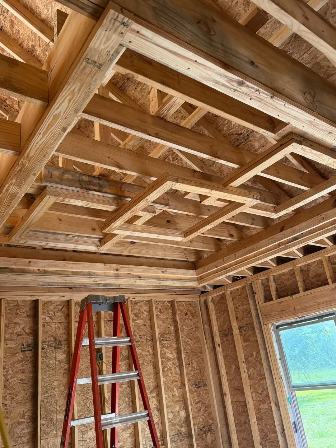 Interior framing, tray/coffered ceiling frame, worker on ladder, Port Acres, TX