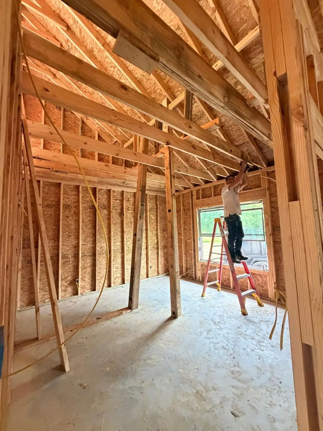 Interior framing, tray/coffered ceiling frame, worker on ladder, Port Acres, TX