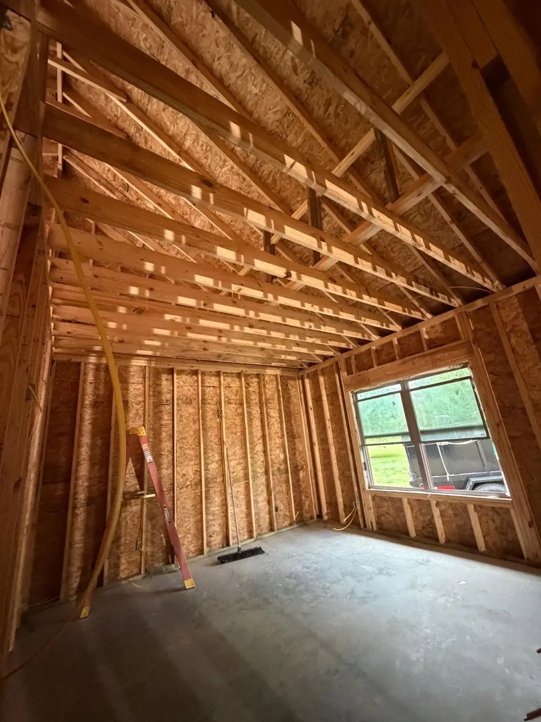 Interior framing, tray/coffered ceiling frame, worker on ladder, Port Acres, TX