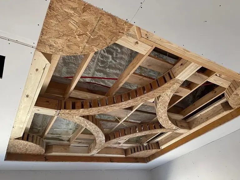 Ceiling framing revealed w/ curved cutouts