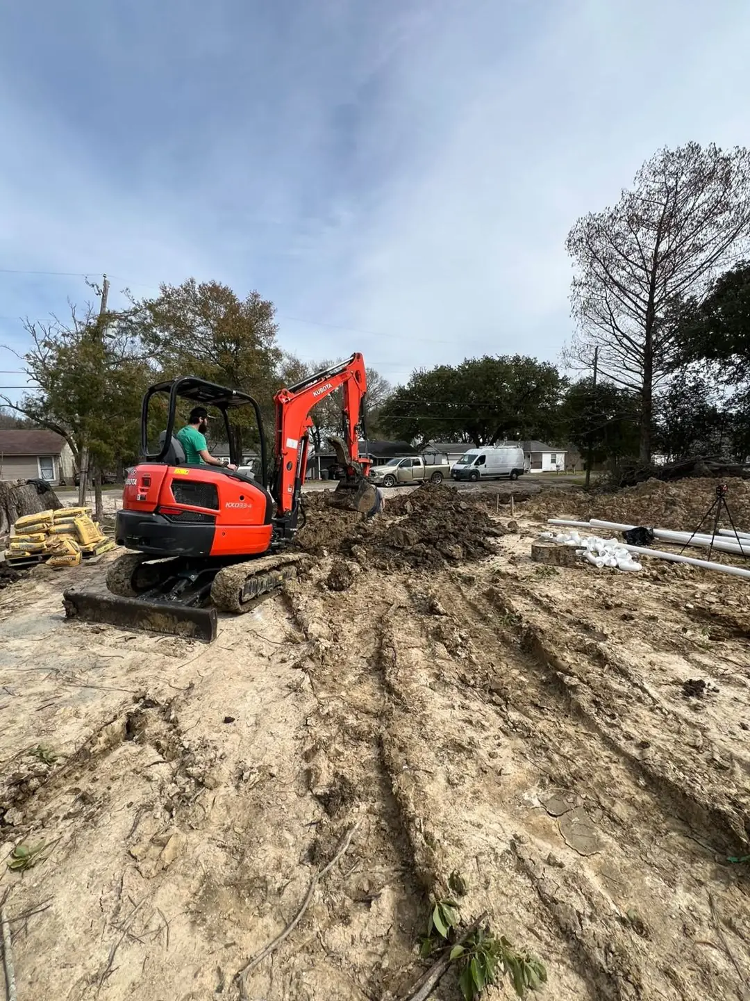 Digging and grading the lot before a slab