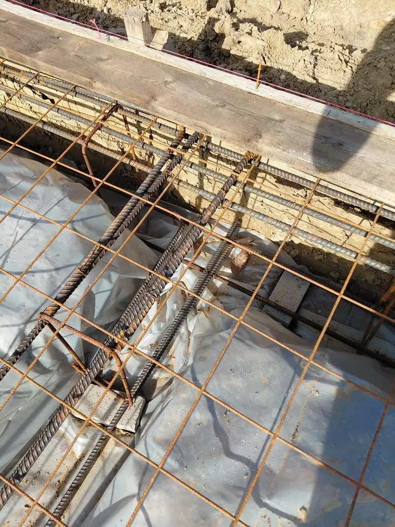 Rebar tied over vapor barrier before a pour