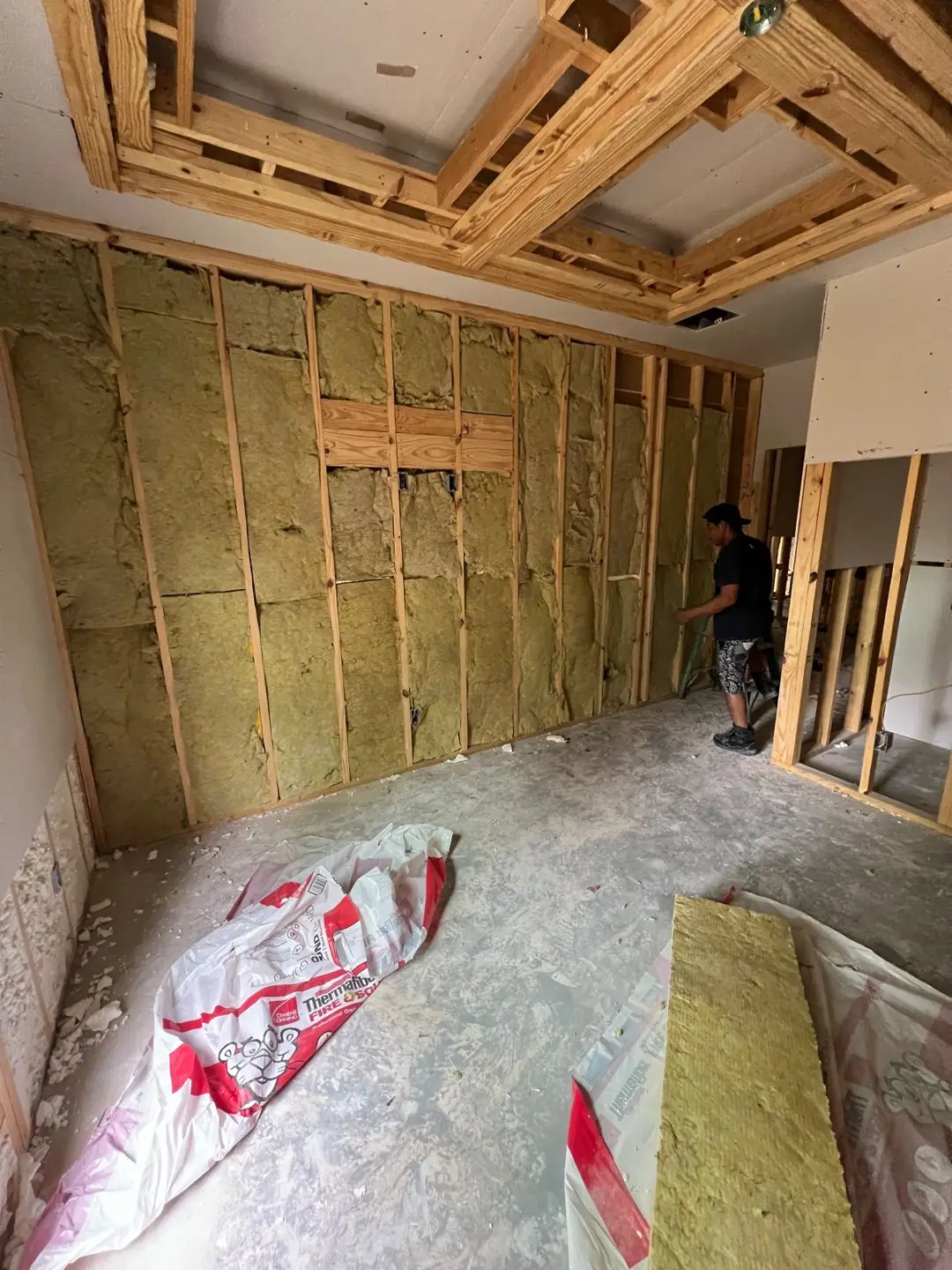 Batt insulation in the walls before drywall