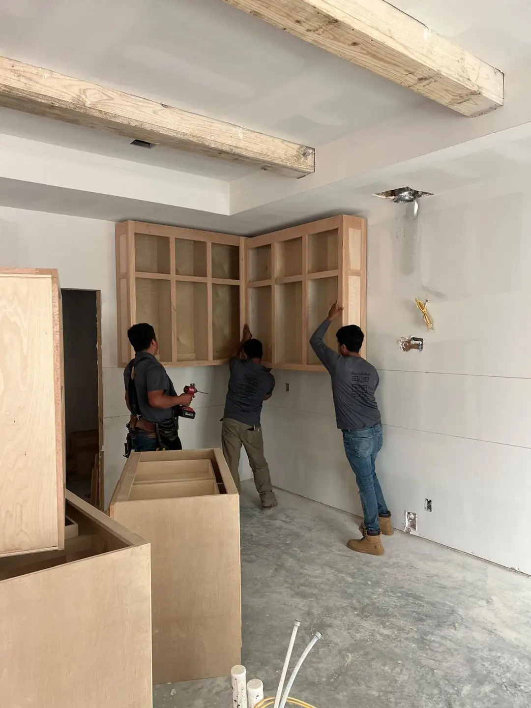 Kitchen cabinets going in / unfinished island, cabinet install crew