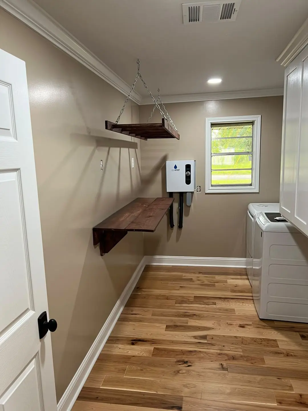 Laundry/utility room remodel: hardwood floor, floating shelves, tankless heater