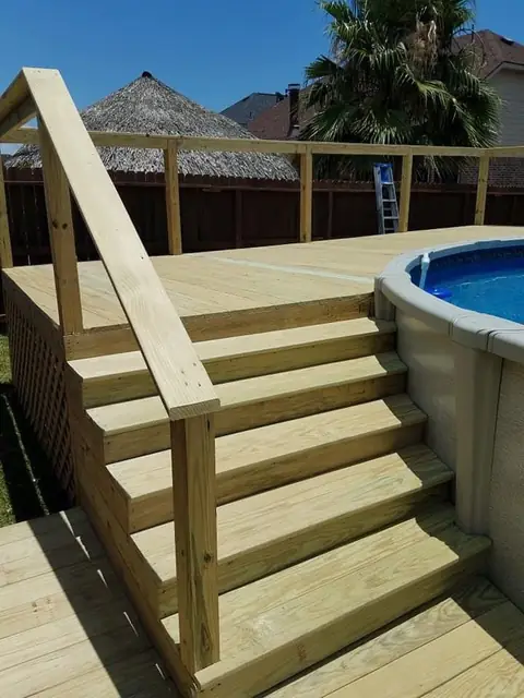 Wood deck + stairs around above-ground pool, railings, Groves, TX