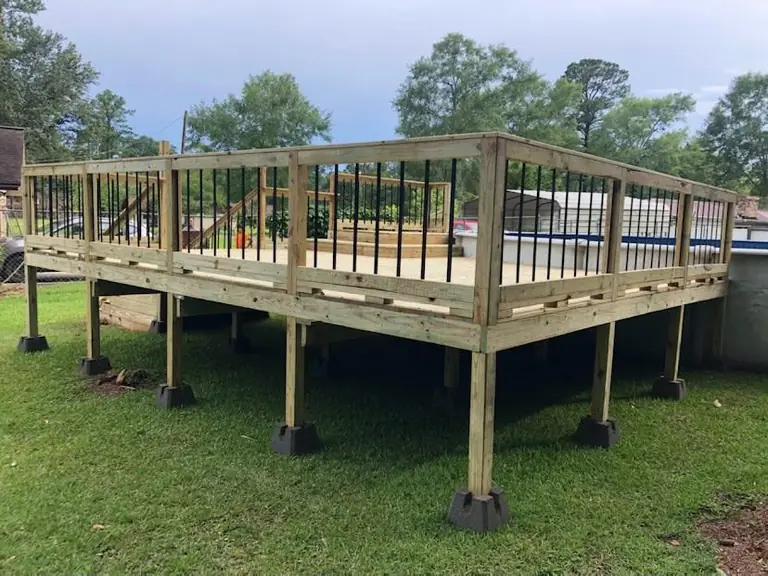 Pool deck, raised deck on piers with black balusters