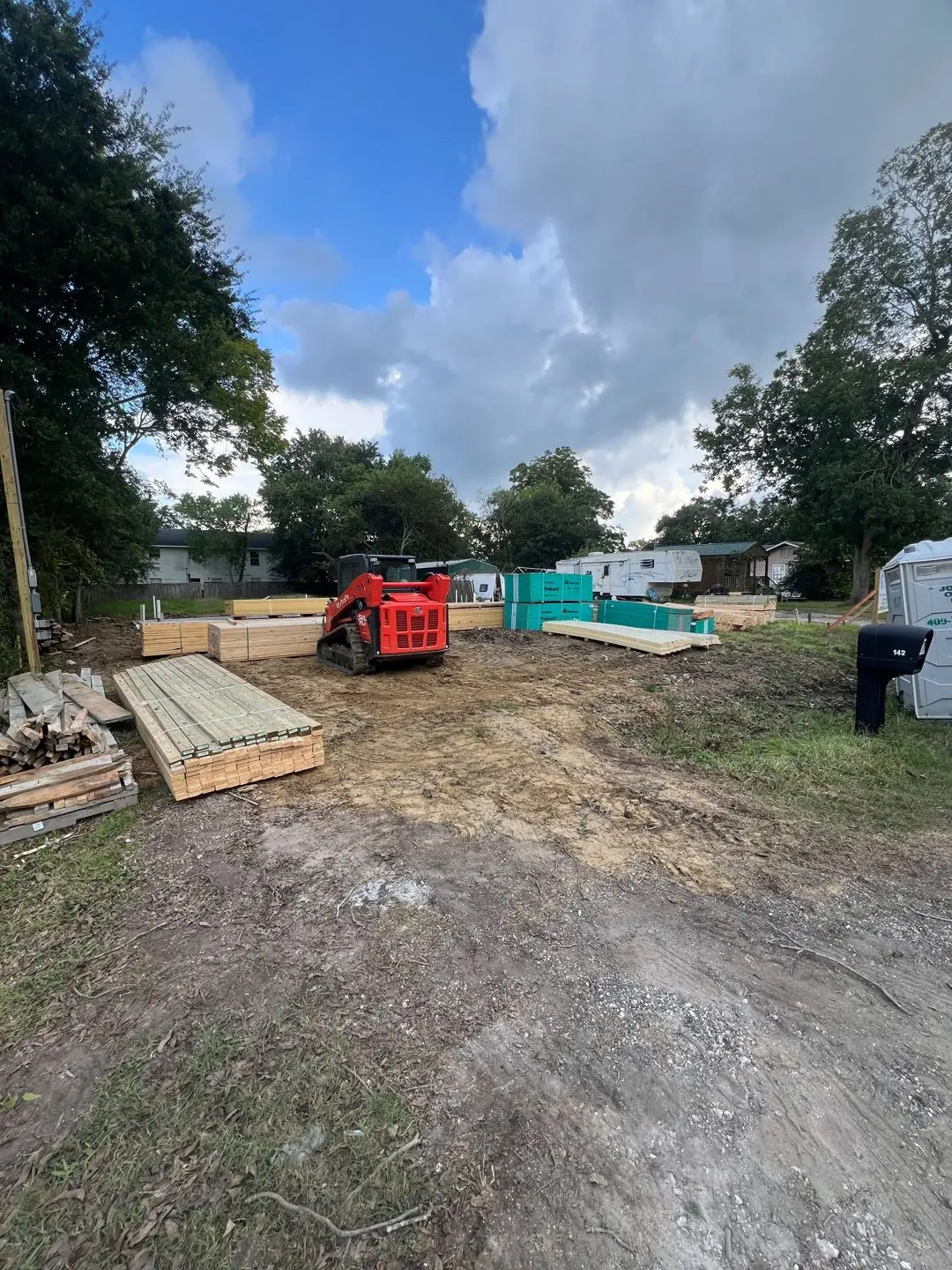 Lumber staged on a prepared lot