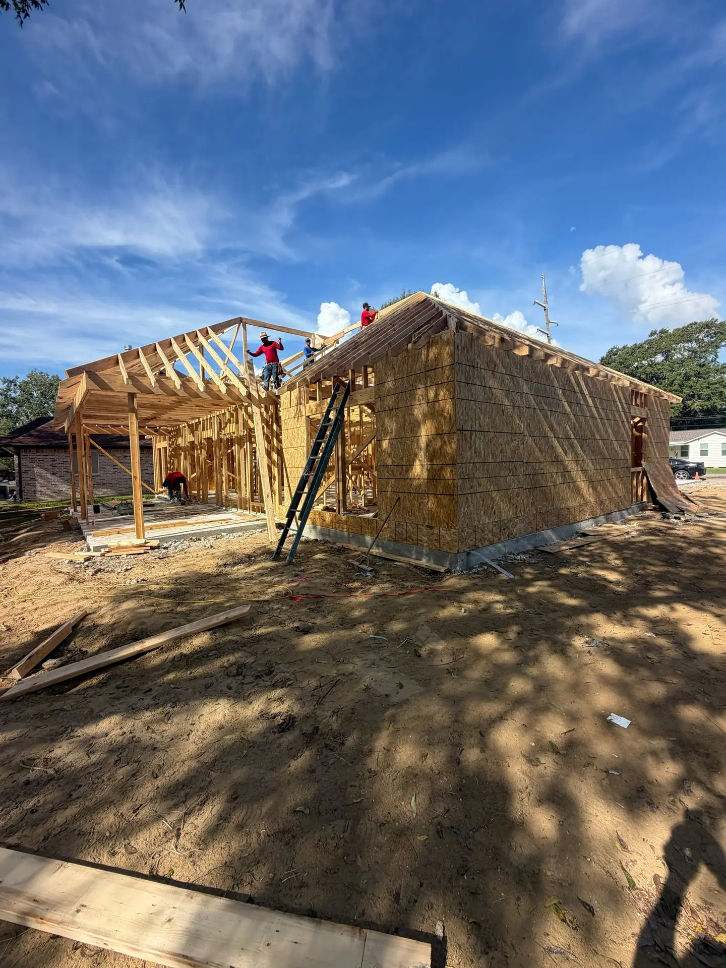 Wood framing and roof trusses going up on a new home